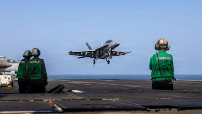 An F/A-18E Super Hornet preparing to make a landing on the flight deck of Nimitz-class aircraft carrier USS Abraham Lincoln. AFP