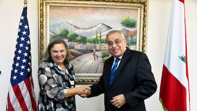 In this photo released by the Lebanese government, Lebanese Foreign Minister Abdullah Bou Habib shakes hands with US Under Secretary of State for Political Affairs Victoria Nuland in Beirut on Thursday. Via AP