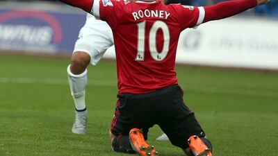 Manchester United's Wayne Rooney reacts after being denied a penalty during his team's loss to Swansea City on Sunday. Geoff Caddick / EPA