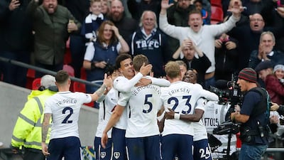 Tottenham teammates celebrate during their 4-1 thrashing of Liverpool at Wembley on Sunday. Frank Augstein / AP Photo