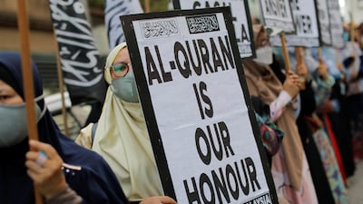 A protest in front of the Swedish embassy after Rasmus Paludan, leader of Danish far-right political party Hard Line, burned a copy of the Quran near the Turkish Embassy in Stockholm, in Kuala Lumpur, Malaysia, on January 27. Reuters