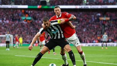 Newcastle United's Sven Botman in action with Manchester United's Wout Weghorst. Reuters