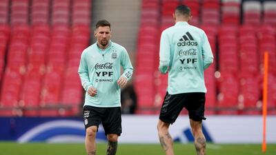 Argentina's Lionel Messi, left, takes part in a training session at Wembley Stadium. AP