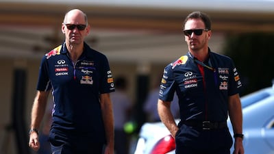 Infiniti Red Bull Racing Team Principal Christian Horner and Adrian Newey, the Chief Technical Officer, arrive in the paddock before final practice ahead of the 2014 Abu Dhabi Formula One Grand Prix. Clive Mason / Getty Images