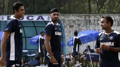 Indian bowlers Anil Kumble, Harbhajan Singh and Amit Mishra are seen during a practice session in New Delhi. Singh is a doubt for the third Test against Australia with a toe injury.