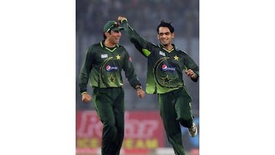 Misbah-ul-Haq, left, celebrates Pakistan's win with Mohammad Hafeez.