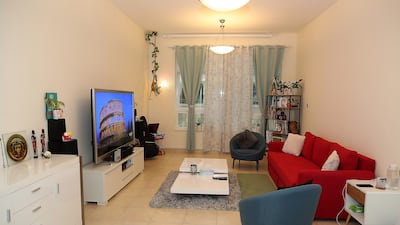 The living room. Most of the couple's furniture is red or white