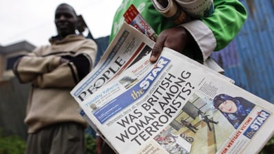 A Kenyan vendor sells a newspaper featuring an article on its front page on the alleged involvement in the terror attack of British woman, Samantha Lewthwait dubbed the 'White Widow'. EPA/Dai Kurokawa