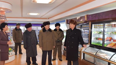 North Korea's party and government officials inspecting stuffed fridges in a supermarket during a ribbon-cutting ceremony to open a Township of Samjiyon County. North Korea's leader Kim Jong Un attended the ceremony. EPA