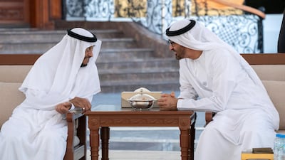 Sheikh Mohamed bin Zayed speaks with Sheikh Sultan bin Zayed, UAE President's Representative (L), during a Sea Palace barza. Mohammed Al Hammadi / Ministry of Presidential Affairs
