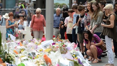 A makeshift memorial near the scene of a fatal siege in the heart of Sydney's financial district. Photo: Peter Parks / AFP