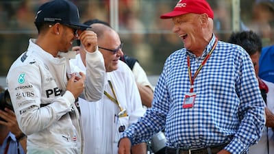 Niki Lauda, non-executive chairman of Mercedes GP, right, laughs with Lewis Hamilton ahead of the race. Mark Thompson / Getty Images