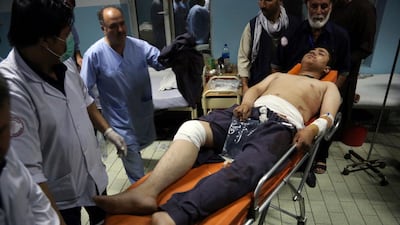 An injured man is brought in to a hospital following a deadly attack in Kabul. AP