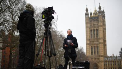 Media do a live broadcast from outside the Houses of Parliament in central London. AFP