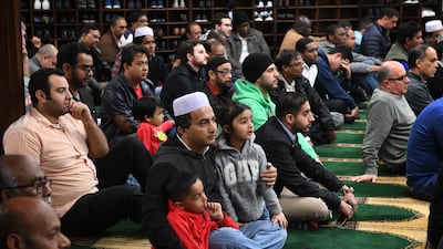 Members of the Islamic community listen during a prayer session in Los Angeles. AFP