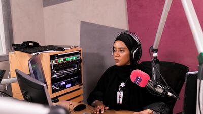 Aisha Al Mazmi speaks on behalf of the nation's youth on her radio show on Sharjah's Pulse 95 Radio. Reem Mohammed / The National