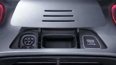 Underneath the charge flap.