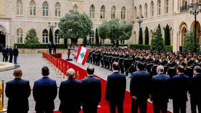 Lebanese Prime Minister Saad Hariri (centre, right) and Egyptian Prime Minister Mostafa Madbouly (centre, left) listen to national anthems at the government palace in downtown Beirut, Lebanon. EPA