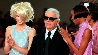 Lagerfeld with Claudia Schiffer and Naomi Campbell at the finale of his Chanel 1997 spring/summer show in Paris. AP