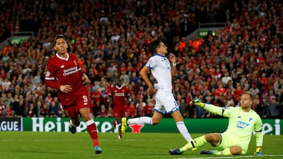 Roberto Firmino celebrates scoring Liverpool's fourth goal as they cruise through to the group states of the Champions League REUTERS/Phil Noble