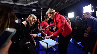 Senator Elizabeth Warren arrives to speak with the press at the Spin Room. AFP