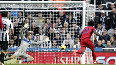 West Bromwich Albion's Belgian striker Romelu Lukaku (R) scores against Tim Krul at St James' Park. Graham Stuart/AFP