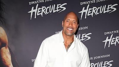 Dwayne Johnson, in a crisp white shirt, arrives at the screening of 'Hercules' at Event Cinemas George Street on June 19, 2014 in Sydney, Australia. Getty Images