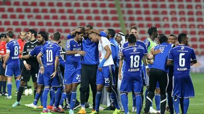 Al Nasr players embrace each other at the final whistle of the Arabian Gulf Cup final. Pawan Singh / The National
