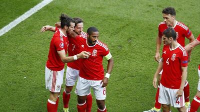Wales' Gareth Bale celebrates with teammates after Northern Ireland's Gareth McAuley scored an own goal in their Euro 2016 last 16 match on Saturday. Christian Hartmann / Reuters / June 25, 2016