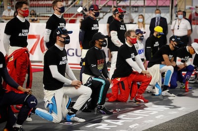 Mercedes driver Lewis Hamilton and ihs Ferrari counterpart Sebastian Vettel take the knee in support of the Black Lives Matter campaign in Bahrain. AP Photo