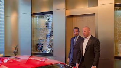 A handout movie still of ‘Furious 7’ showing Paul Waker and Vin Diesel. Courtesy Universal Pictures
