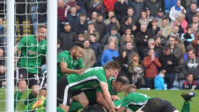 Sean Raggett is mobbed by Lincoln City teammates after scoring the winning goal against Burnley in the FA Cup fifth round. Anthony Devlin / AFP