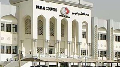 A British man appeared in court accused of assaulting two police officers in Dubai.