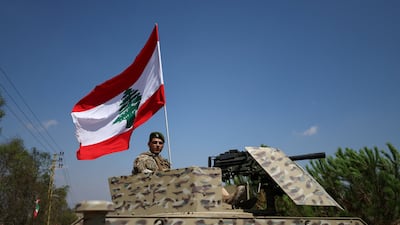 A Lebanese soldier sits on an armoured vehicle in the southern town of Zawtar Al Gharbiyeh. Reuters