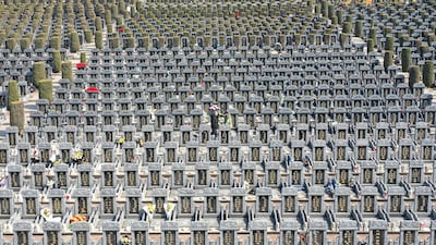 People pay their respects at a cemetery ahead of the Qingming festival, also known as the Tomb-Sweeping festival, in Shenyang, north-eastern China's Liaoning province. AFP