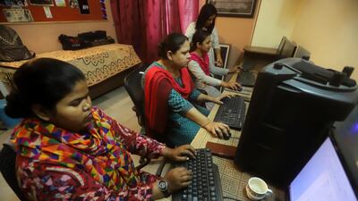 Aisha Khatoon, third from left, works on a video editing project at an institute in Lucknow. Jitendra Prakash for The National