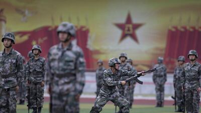 Chinese People’s Liberation Army cadets take part in a bayonet drills at the PLA’s Armoured Forces Engineering Academy Base, in the outskirt of Beijing, China. Andy Wong / AP