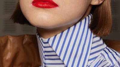 1980's era blue eye shadow and a bright lip at the Viktor & Rolf autumn/winter 2022 haute couture show. Getty