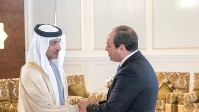 Sheikh Hazza bin Zayed, Vice Chairman of the Abu Dhabi Executive Council (L), greets Abdel Fattah El Sisi, President of Egypt (R), during a reception at the Presidential Airport. Rashed Al Mansoori / Crown Prince Court - Abu Dhabi