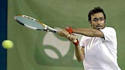 Omar Behrouzian returns a volley to Neil Bulliant during yesterday's final in Dubai.