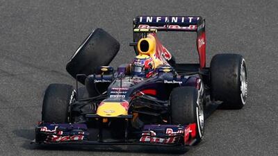 Red Bull's Mark Webber is forced to retire after losing his rear wheel following a collision in Shanghai.