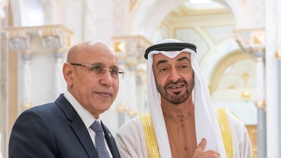 Sheikh Mohamed bin Zayed, Crown Prince of Abu Dhabi and Deputy Supreme Commander of the Armed Forces, and Mohamed Ghazouani, President of Mauritania, stand for a photograph wearing Expo 2020 wristband, during an official visit at Qasr Al Watan. Rashed Al Mansoori / Ministry of Presidential Affairs