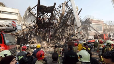 The mangled steel structure of Iran’s oldest high-rise, the Plasco building, after it because of a fire. AFP