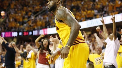 Fans cheer behind LeBron James during the Game 3 win in the Eastern Conference finals on Sunday night. Gregory Shamus / Getty Images / AFP / May 24, 2015