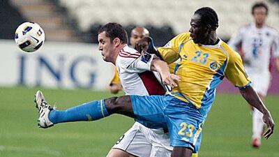 Bare, left, has scored nine times in the Pro League this season for Al Jazira and is determined to help the Al Jazira side take the title.