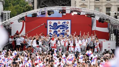 The England women's squad celebrate with the public in Trafalgar Square, London, on Monday after their historic victory in the Euro 2022 football tournament. The Lionesses defeated Germany on Sunday to clinch their first European championship. Getty