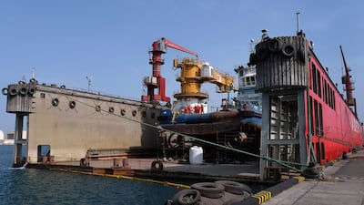 Abu Dhabi Ship Building’s floating dry dock at Mina Zayed allows it to service vessels much larger than can be handled at its Musaffah facility. Delores Johnson / The National
