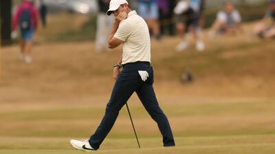 Rory McIlroy reacts after missing a birdie putt on the 14th hole during the final round of the Open. AP