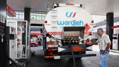 A worker fills up a storage tank at a petrol station in Beirut, Lebanon. Fuel, along with medicine and wheat, are among the items set to rise in price when government subsidies run out. Reuters