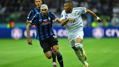 Atalanta's Davide Zappacosta in action with Real Madrid's Kylian Mbappe. Reuters